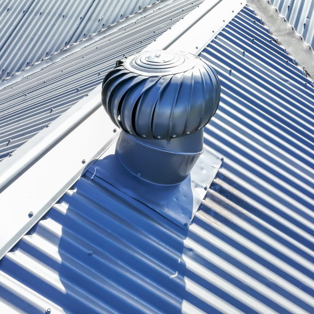 Drone aerial photograph of Whirlybird a grey coated corrugated iron roof on a domestic residence